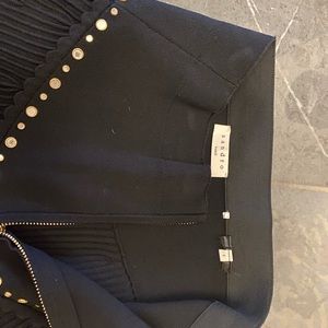 Black A line knit mini skirt with gold zipper in back with embellishments